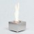 Petite cheminée bio de table en acier inoxydable. Brûleur de 0,5 L fournissant jusqu'à 2 heures de combustion.